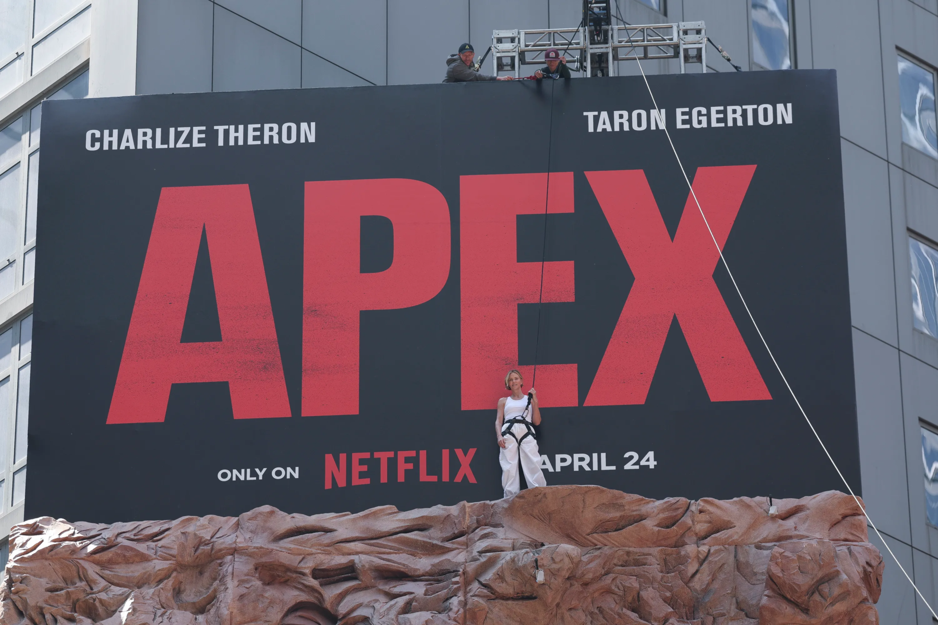 charlize-theron-climbing- ads-apex