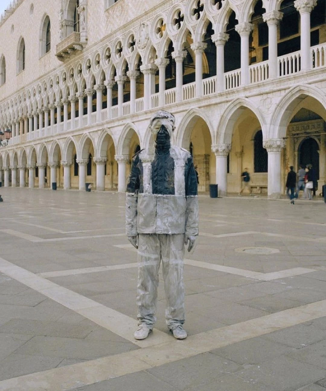 Liu Bolin, widely known as “The Invisible Man,” constructs photographs in which his own body is (4)